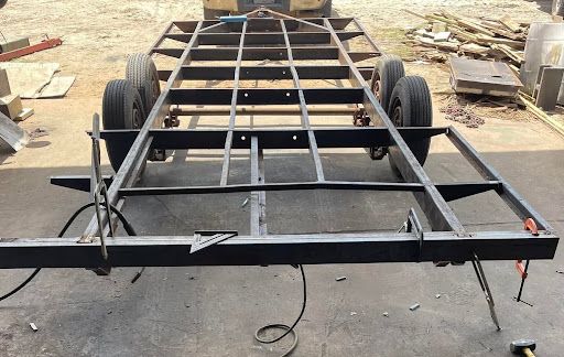 New steel crossmembers welded onto a utility trailer frame